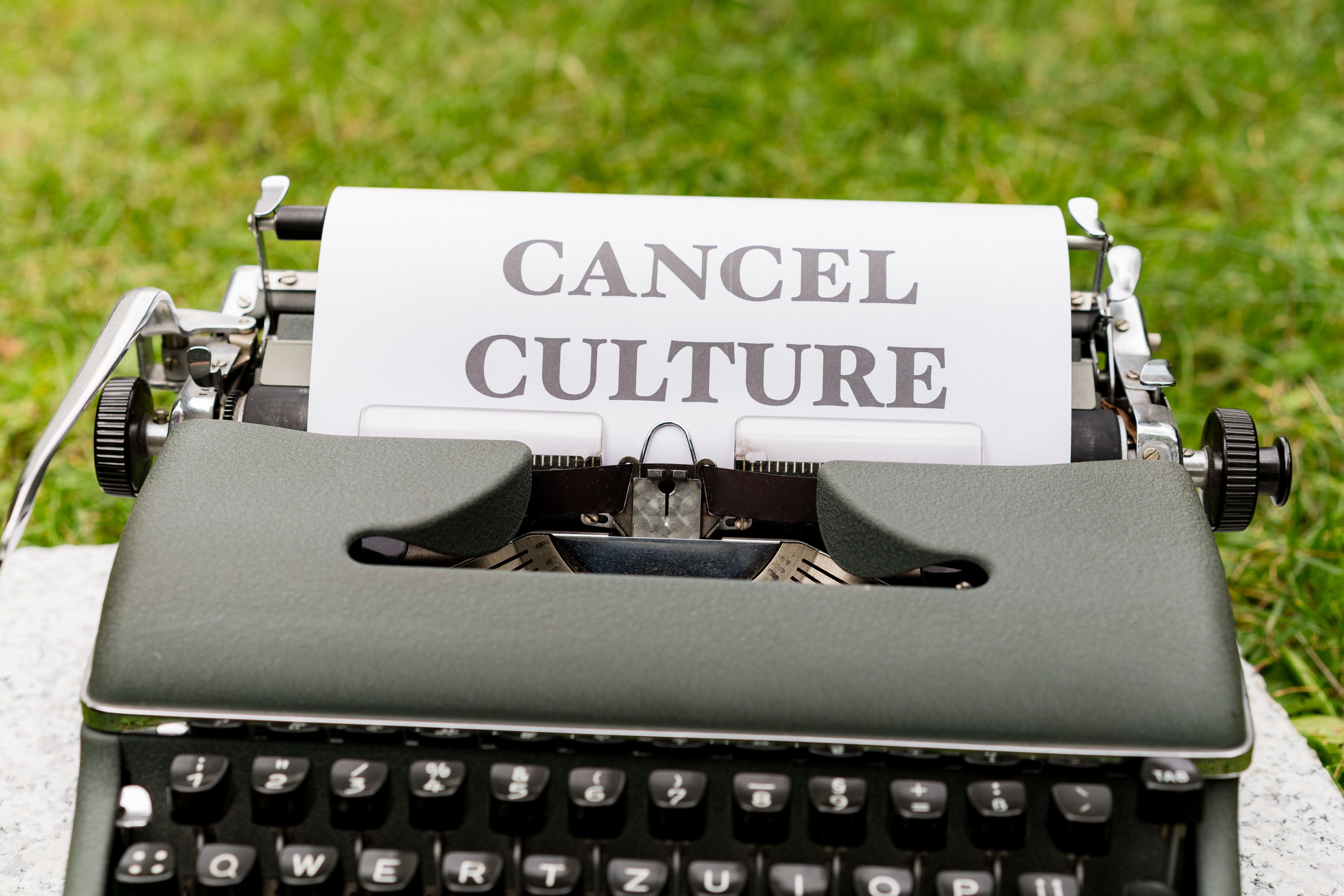 Vintage typewriter with 'Cancel Culture' typed on paper, illustrating online backlash against celebrities over Taiwan comments