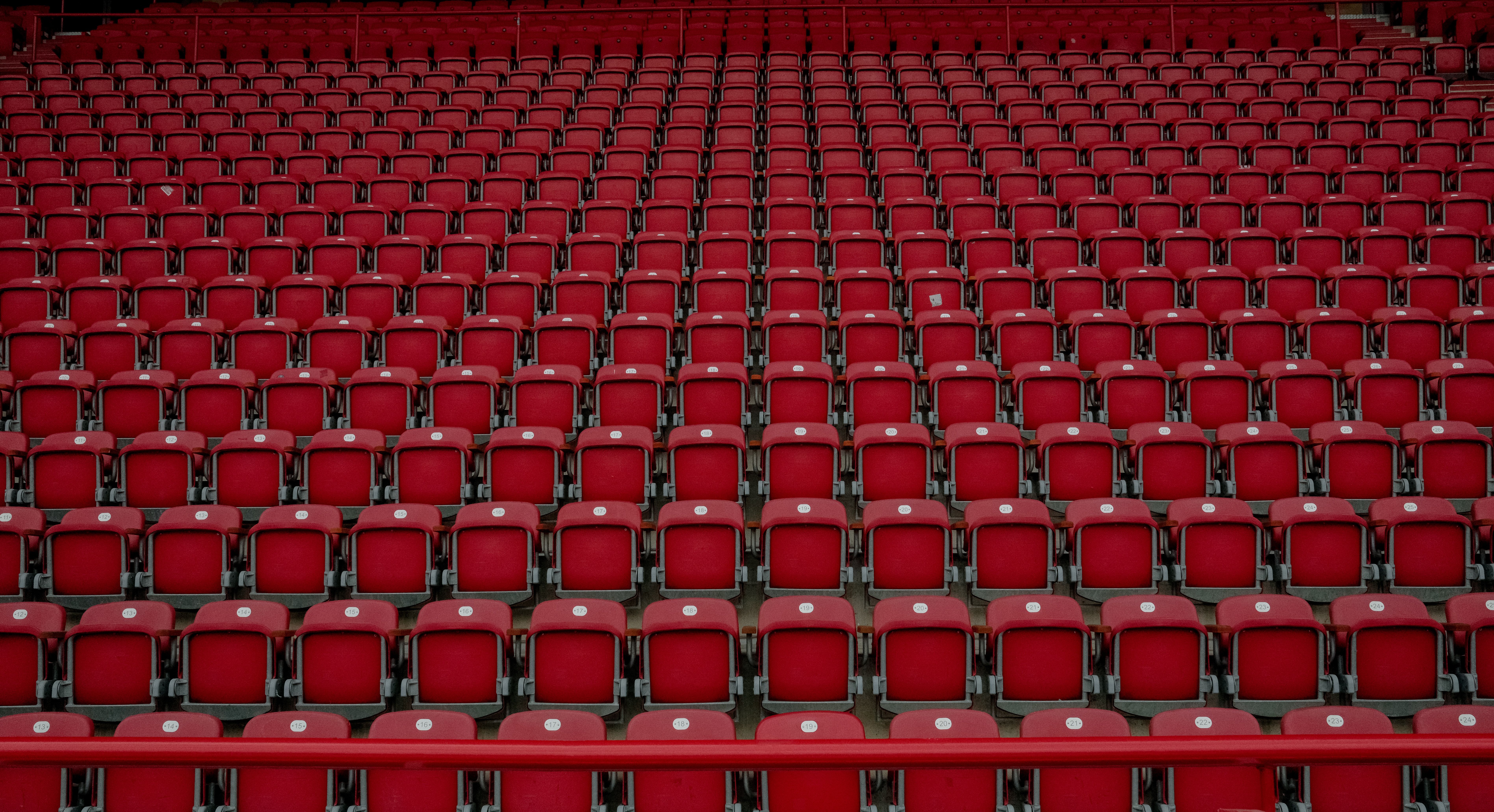Rows of empty stadium seats symbolizing celebrities losing fans over Taiwan comments