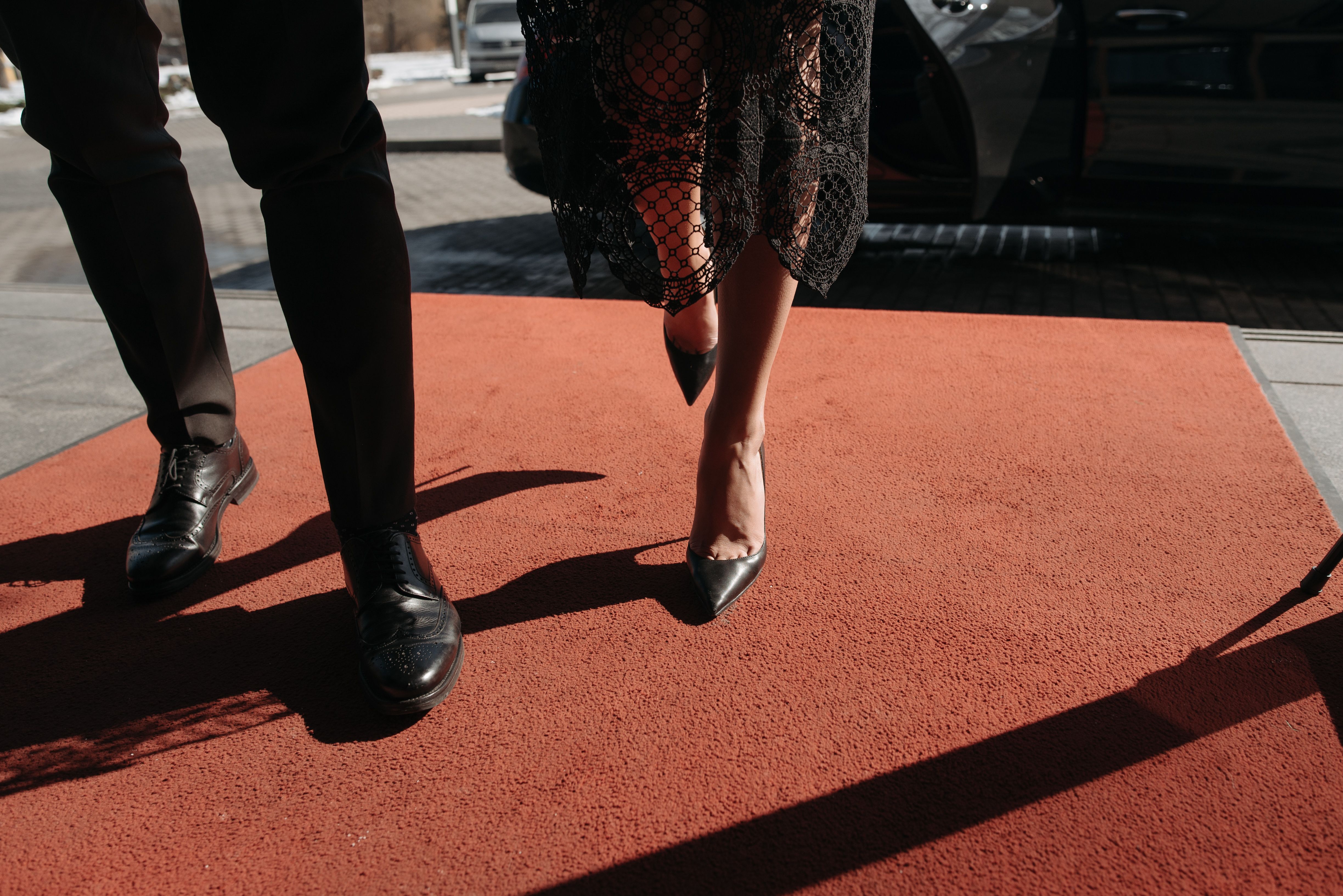 Glamorous couple arriving on the red carpet at a Hollywood event