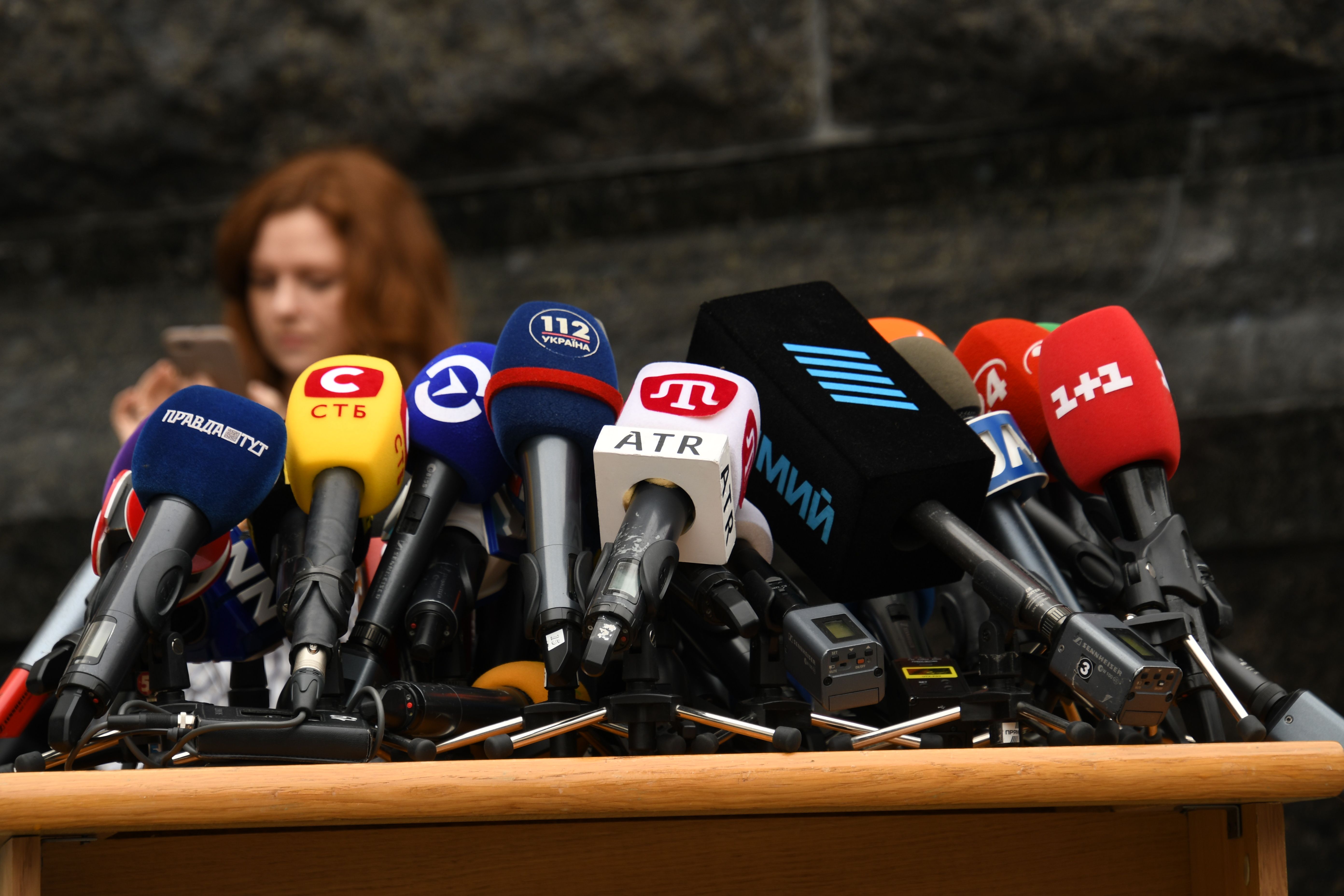 Cluster of microphones set up at a press conference where a star might make controversial Taiwan comments